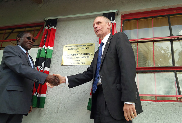 Laikipia University Vice-Chancellor(left) shakes hands with U.S. ambassador to Kenya Robert Godec during the launch of Human Rights Center.